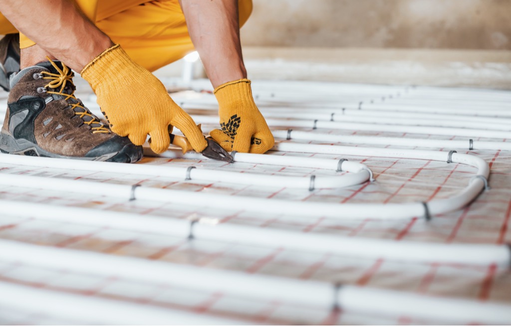 Workman installs underfloor heating